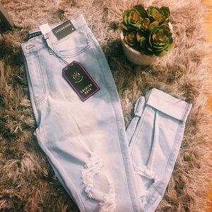 Distressed denim jeans from Fashion Nova.